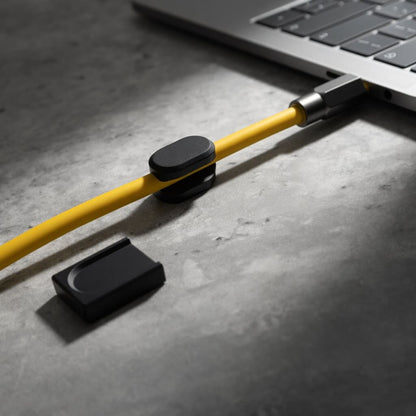 Magnetic cable organizer showing compatibility with round flat power and data cables