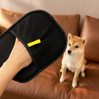 Reusable pet hair remover mitt with collected fur strip after cleaning upholstery